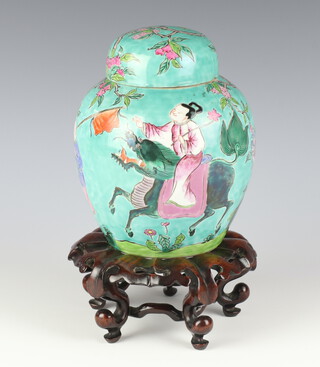 A famille rose turquoise ground jar and cover, Qianlong mark, 20th Century complete with stand 18cm h