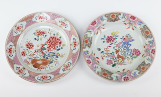 Two Chinese export famille rose plates, Qing dynasty, Qianlong period one painted with a deer amongst peony and rockwork, the other with a phoenix amongst peony 22.5cm diameter (2)