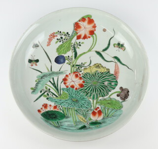 A famille vert "Lotus" dish, Qing dynasty, Kangxi period, painted to the interior with a lotus pond and butterflies 34.2cm diam