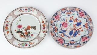 Two Chinese export famille rose plates, Qing dynasty, Qianlong period one painted with a design of peony with an elaborate peony border, the other with peony below panels of flowers at the rim 22.8cm and 23.4cm respectively