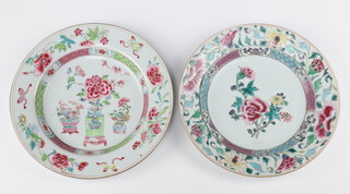 Two Chinese export famille rose dishes, Qing dynasty, Qianlong period one painted with peony, the other with vases of flowers 22cm and 22.5cm diam respectively 
 (2)