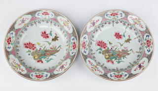 A pair of Chinese export famille rose bowls, Qing dynasty, Qianlong period, each painted with antiques on a leaf amongst peony 22.8cm diam