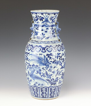 A large Chinese blue and white baluster vase, late Qing dynasty, painted with birds and flowers having dragon handles the interior lip with unusual moulding 47.5cm h