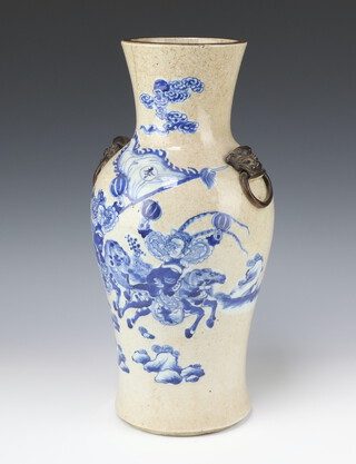 A large blue and white baluster crackled vase, late Qing dynasty, painted with figures on horseback and lion ring handles 45cm h