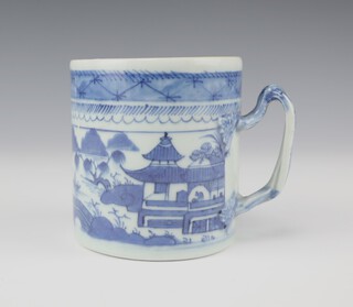 A Chinese 19th century export blue and white mug with extensive riverscape and entwined handle 9.5cm