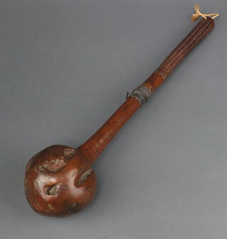 A 19th Century Fijian throwing club (I Ula Drisia) with bulbous root stock head, the centre of the handle with 2.5cm binding, the 14cm base of the handle with geometric zig zags between lines 41cm l