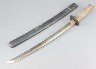 A 19th Century Japanese Wakizashi Koshirae (side sword) likely from the Satsuma rebellion with pierced iron tsuba signed 'Kunihiro' and tightly bound tsuka on ray skin (no menuki), leather clad saya and copper habaki, the blade length excluding habaki 41cm, the tang is unsigned,the overall length including the saya 62cm 
