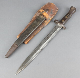 A Lee Metford mark 1, type 2 bayonet, the base of the blade with numerous marks, complete with leather scabbard and leather frog marked C T Brock & Co.  