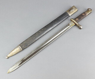 A Spanish bayonet, the blade marked 41868 complete with leather scabbard