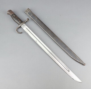 A Japanese Type 30 bayonet with wooden grip, the blade with star mark and complete with scabbard 