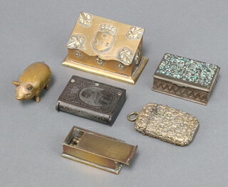 A 19th Century gilt metal tape measure in the form of a pig with hardstone set eyes 4cm, an embossed metal vesta case, 1 other to commemorate King Edward VII Coronation, 4 gilt metal crib markers in a metal box, Continental wedge shaped stamp box, rectangular pill box 