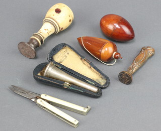 A Victorian steel seal with turned bone terminal, gilt metal seal, pair of folding scissors with bone grips, 2 turned treen thimble cases and a Pearsons and Co prototype mouthpiece in a leather case 