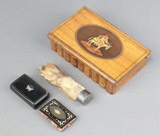 An olive wood trinket box in the form of book containing a hare's pad, a Victorian black lacquered snuff box with mother of pearl inlay and a miniature French pocket book 