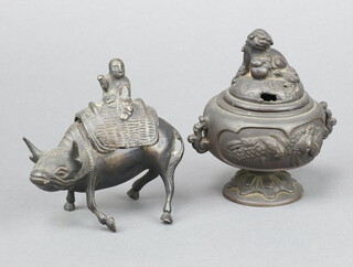 A Japanese bronze twin handled koro, the lid decorated seated dog of fo on a circular base 10cm x 5cm together with a Japanese figure of an ox 8cm 