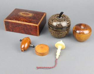 A black and gilt lacquered trinket box in the form of an apple 9cm x 7cm, turned wooden trinket box in the form of an apple 7cm x 7cm, ditto jar and cover 2cm x 5cm, lamp switch and a light pull contained in a figured walnut box 6cm x 7cm x 13cm 