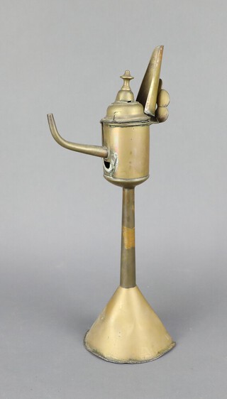 An 18th Century Dutch brass whale oil lamp, raised on a spreading foot 37cm h x 13cm w x 10cm d 