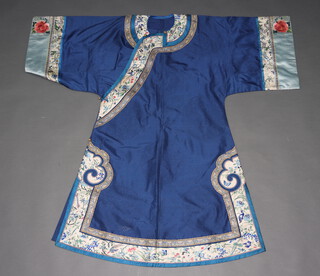 A Chinese blue summer silk gauze women's informal robe, Qing Dynasty, circa 1890 showing influence of Empress Dowager Cixi. The body of the robe woven circular panels of dragons, the body trimmed in royal blue then cream decorated foliage flowers, birds and Pagodas then gilt decorated butterflies. The sleeves trimmed in sky blue decorated pink roses and insects and then cream decorated as per the body. 121cm collar to hem