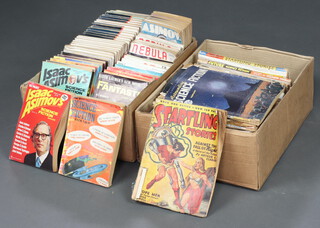 A collection of late 1940's, 50's, 60's and 70's science fiction magazines to include "Astounding Science Fiction", "Startling Stories", "Thrilling Wonder Stories", "Analogue Science Fiction", "Isaac Asimov Science Fiction Magazine", "Nebular Science Fiction Magazine", etc 