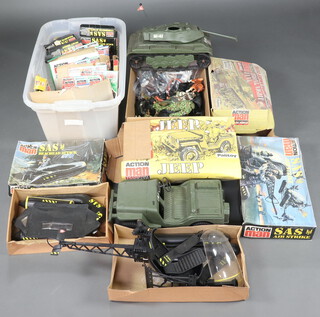 Action Man, a large collection of loose uniforms, weapons and empty boxes, together with the SAS Air Strike helicopter boxed, Iron Knight tank boxed, SAS Beached Attack dinghy boxed, Jeep boxed, empty boxes of SAS Underwater Attack, The Armoury, Equipment Centre, SAS Key Figure, SAS Parachute Attack, SAS Secret Mission, US Machine Gunner Outfit, US Paratrooper Outfit, Nato Night Manoeuvers, Mountain and Arctic Uniform, Underwater Explorer, Sabotage Outfit, British Infantry Major Outfit, Parachute Regiment Outfit, British Infantry Major Outfit, Long Range Desert Group Outfit, US Machine Gunner Outfit, El Alamein Weapons Arsenal, Commando Outfit, Royal Engineers Outfit and Skydiver Outfit, Action Man basic figure, Action Man Soldier, 4 Action Man figures and a husky   