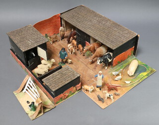 New Forest Toys, Brockenhurst, a boxed fold out farmyard play set comprising pig stys, stables and pond, a metal water pump & bucket, together with carved wooden and painted figures of 3 cows and a calf, 2 horses, 2 foals, 1 sow, 1 doe, 5 dogs, 3 sheep, a lamb, 2 geese and a gosling, a milkmaid, a farm hand and a shepherd, made in the New Forest attributed to Frank Whittington (1876-1973)