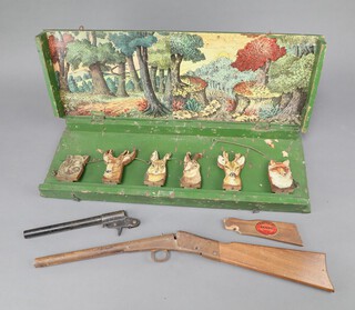 F H Ayres (The Hunting Game), a fold out wooden shooting game complete with gun and pop up figures of game, the interior painted a forest scene, circa 1905 