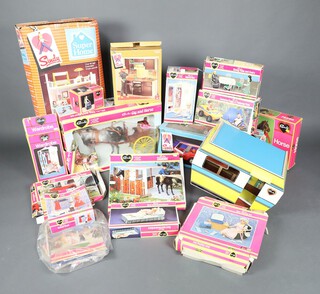 A large collection of Sindy play sets to include caravan, wardrobe, super home, gown rail, rocker, wardrobe, fridge, bed and bed clothes, dining table and chairs, Gig and Horse, cooker unit, horse and Range Rover, together with a collection of Sindy Dolls and a large collection of clothes/costumes  