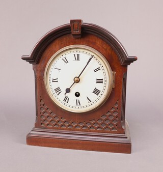 An Edwardian bracket timepiece with 14cm enamelled dial, Roman numerals, contained in a mahogany arch shaped case complete with pendulum and key 29cm x 24cm x 14cm 