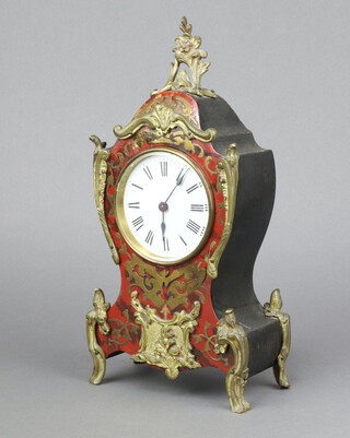 A 19th Century French 8 day timepiece with 8cm enamelled dial, Roman numerals, contained in a red boulle and gilt metal shaped case 31cm h x 15cm w x 8cm d 