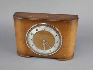 A 1950's Insurance timepiece with silvered dial and Arabic numerals contained in an oak D shaped case, complete with leaflet 19cm x 27cm x 7cm