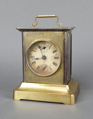 A Junghans musical alarm clock the paper dial with Roman numerals, subsidiary second hand, alarm dial, contained in a gilt metal case complete with key 15cm x 13cm x 10cm