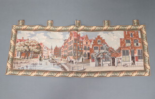 A Continental machine made tapestry of a canal scene with buildings 150cm x 58cm 