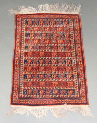 A black and orange ground Afghan rug decorated stylised animals within a 3 row border 128cm x 87cm 