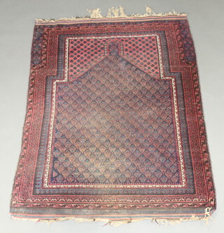 A blue and red ground Afghan prayer rug with multi row border 145cm x 110cm 