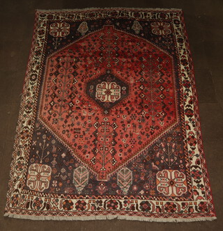 A red, blue and white ground Afghan carpet with central medallion 292cm x 210cm, some wear and flecking in places 