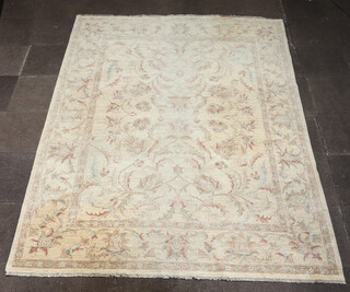 A Pakistani white and floral patterned Caucasian style carpet 313cm x 249cm 