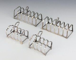 A pair of silver 7 bar toast racks Birmingham 1933, 11cm, a smaller pair Birmingham 1958 7cm, 202 grams 