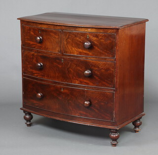 A 19th Century mahogany bow front chest of 2 short and 2 long drawers, raised on bun feet 92cm h x 94cm w x 53cm d 