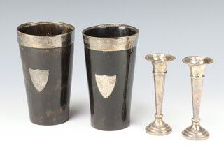 A pair of Athletic trophy cups in the form of horn beakers, the silver mounts to the top both engraved  "Won by R Smithson for throwing a cricket ball 90 yards" and "1/4 mile handicap hurdle race" the bodies with engraved armorials Birmingham 1883 14cm, together with a pair of silver spill vases 11cm 