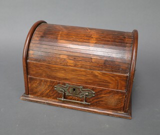 A Victorian oak dome shaped smoker's cabinet with tambour shutter, the base fitted a drawer with pierced swan drop handles, 19cm h x 29cm w x 21cm d 