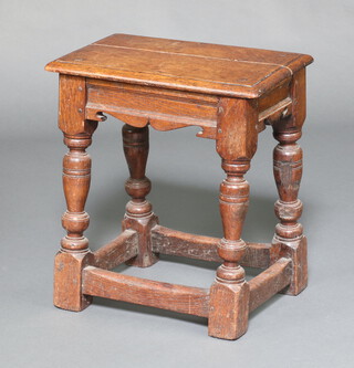 An 18th/19th Century oak joined stool raised on cup and cover supports with box framed stretcher 48cm h x 43cm w x 28cm d 