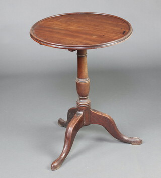 A 19th Century circular mahogany dish and snap top wine table, raised on a turned column and tripod base 73cm h x 55cm diam.  