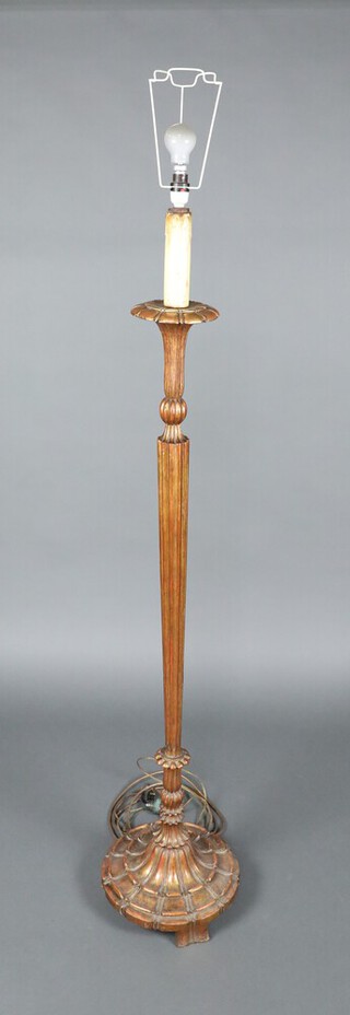 An Italian style carved and reeded giltwood standard lamp on a circular base 130cm h x 30cm diam to base