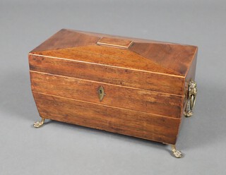 A Georgian inlaid mahogany tea caddy of sarcophagus form with brass ring drop handles raised on brass feet 17cm h x 30cm w x 15cm d 