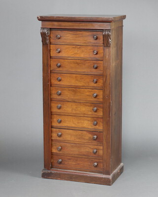 A Victorian mahogany Wellington chest of 10 drawers with scrolled columns to the sides, raised on a platform base 134cm h x 62cm w x 39cm d 