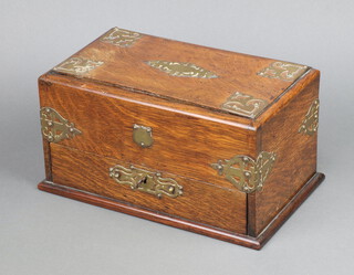 A Victorian rectangular oak and brass mounted smokers cabinet, the base fitted a drawer with patented sliding top 16cm h x 30cm w x 11cm d 