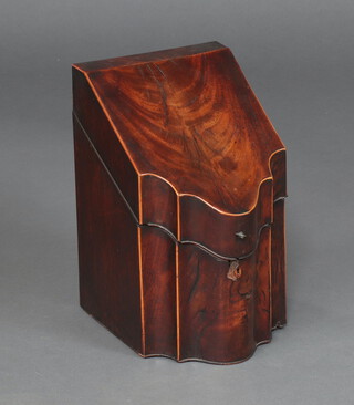 A Georgian inlaid mahogany knife box of serpentine outline and hinged lid revealing a well fitted interior 35cm h x 22cm w x 26cm d  