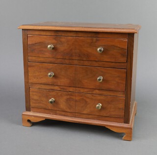 A Queen Anne style quarter veneered walnut apprentice chest fitted 3 drawers with gilt handles, raised on bracket feet 25cm h x 27cm x 16cm  