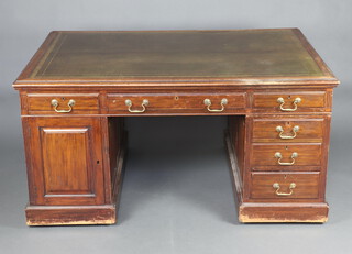 A 19th Century mahogany partners desk with inset green leather writing surface, the frieze fitted 2 long drawers, the pedestals 8 short drawers and double cupboard, 67cm h x 160cm w 75cm d  