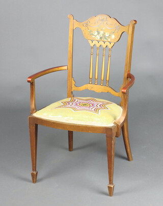 An Edwardian gilt painted open armchair with spindle decoration, the back painted flowers and with Berlin woolwork seat raised on square tapered supports 79cm h x 53cm w x 41cm d 