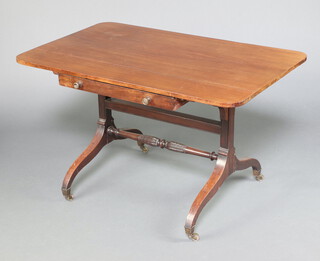 A 19th Century mahogany writing/library table fitted a frieze drawer on square supports with turned H framed stretcher, brass caps and casters 68cm h x 111cm w x 69cm d  